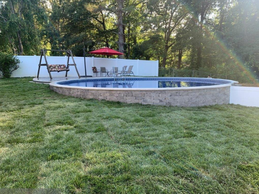 Above-ground pool on a sloped backyard: