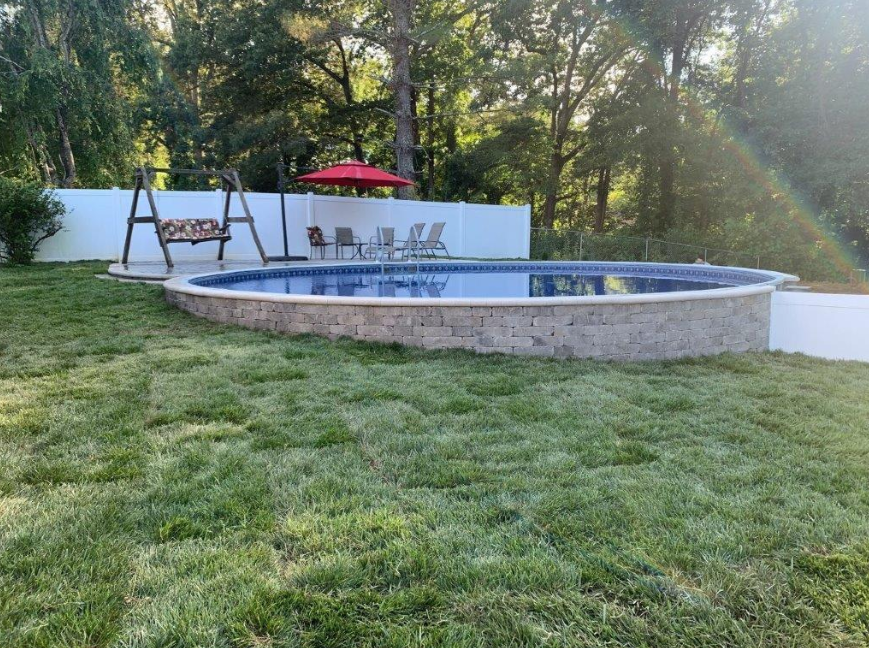 Above-ground pool on a sloped backyard: